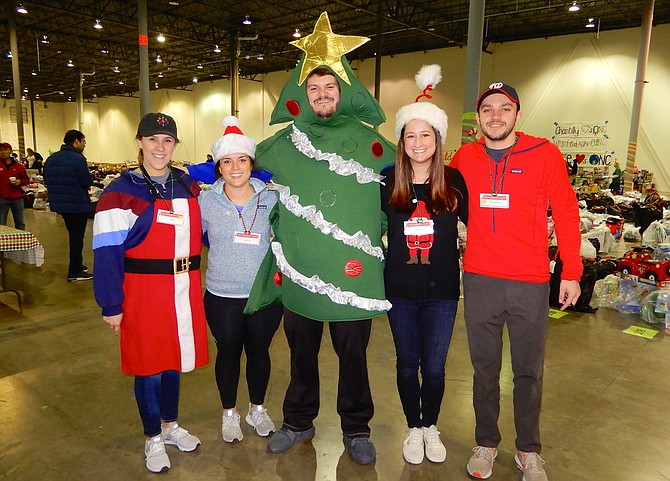 These employees of Tableau Software show their Christmas spirit. From left are Stephanie Weiss, Martha Shanfeld, Adam Gutekunst, Caroline Orr and Jason Warren.