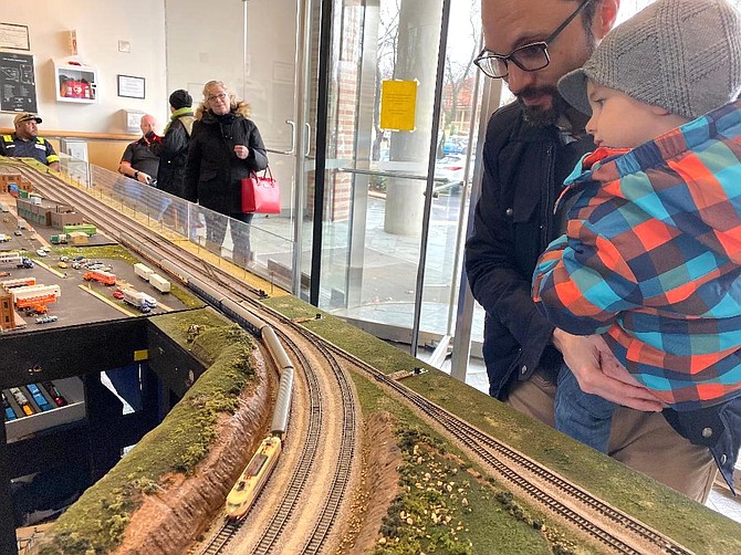 Luca Corso, 3, learns all about trains from his dad Phil, who likes the smaller N scale models.