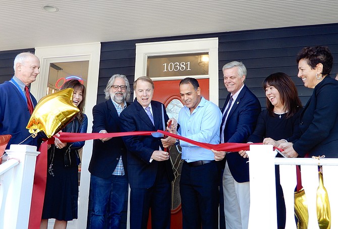 Cutting the ribbon are (from left), City treasurer Tom Scibilia, Council members So Lim and Michael DeMarco, Mayor David Meyer, Dave Omary, Page Johnson, Kelly Seungyon, and Sharon Ricciardi with the Central Fairfax Chamber of Commerce.