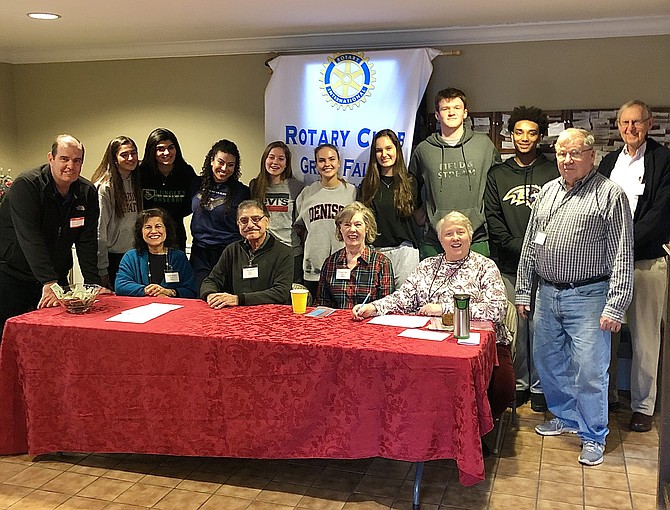 Sean Plunkett, Madhu Bhatia, Anil Bhatia, Eileen Curtis, Karen Magley, Phil Magley, and Milt Critchfield of the Rotary Club of Great Falls are joined by eight Langley High School students involved in the Rotary Club's teen group, Interact.