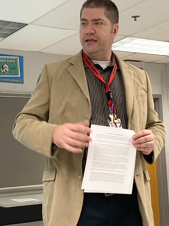 Dean of Students at Herndon Middle School,  Dr. John Bordenkecher, provides additional information about video monitoring during a parent information meeting held Jan. 13. Interested in learning more, only two community individuals attended.