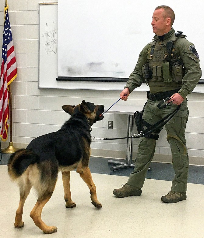 K9 Officer Weeks puts his dog, Dozer, through his paces.