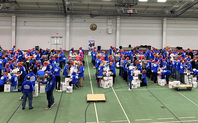 More than 300 Islamic Relief USA volunteers package meals for distribution to food banks during the Jan. 19 day of service at Episcopal High School in honor of Martin Luther King Jr.