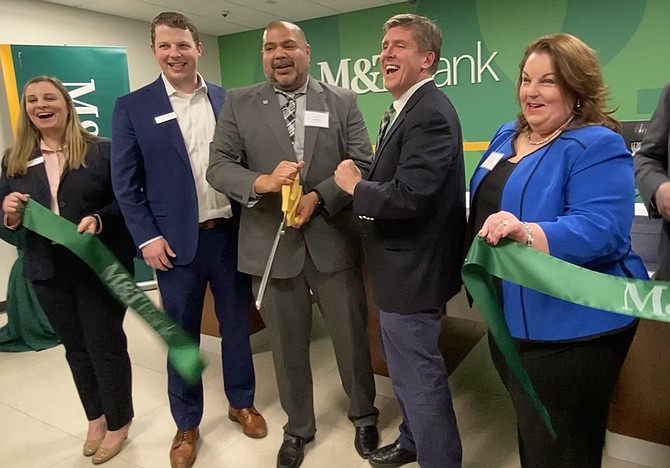 When the first pair of shears didn't cut it at the ceremonial ribbon-cutting for the Grand Opening of M&T Bank, Metro Center Drive, Reston, "take 2" brings laughter from (left to right) Tara Abraham, Assistant Vice President and Retail Support Specialist M&T Bank; Chris Nichols, Business Banking Market Manager in Greater Washington M&T Bank; Dee Kakar, Vice President Business Banking Team Leader in Northern Virginia M&T Bank; Supervisor Walter Alcorn (D-Hunter Mill).
