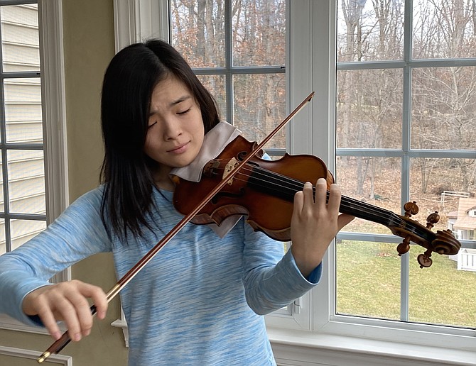 Kayleigh Kim, 15, of Oak Hill, always dreamed of participating in the prestigious Menuhin Competition, dubbed the "Olympics of the Violin." Selected as a finalist, she is dedicated to practicing for the event.