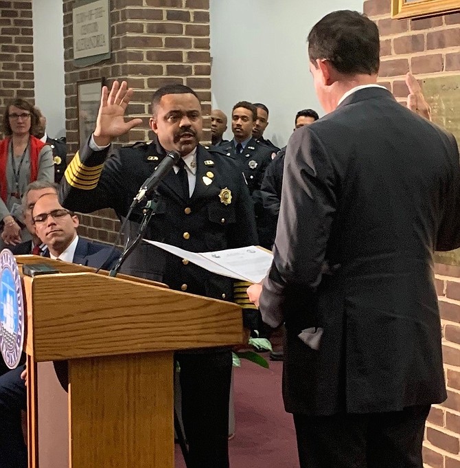 Alexandria Fire Chief Corey Smedley is sworn in by Circuit Court Clerk Greg Parks during a Jan. 28 ceremony at City Hall. Smedley was named to the role in December, becoming the city’s first African American Fire Chief.