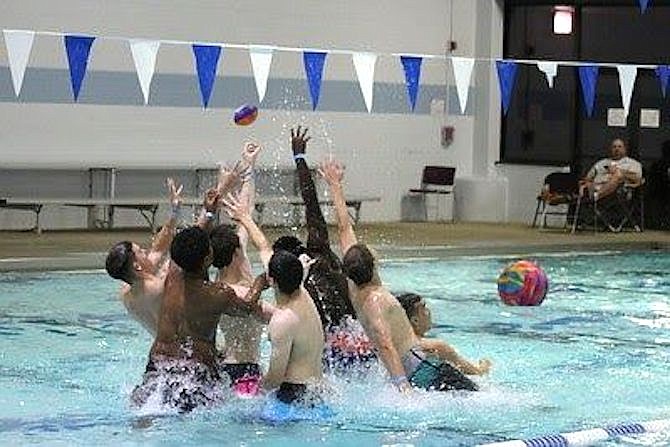 Playing football in the pool on graduation night is a part of the all-night graduation parties, which don't happen without fundraising.