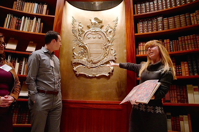 Clare Moore, right, gives attendees a tour of the vault, which holds Washington’s books and rare manuscripts, during The Leadership Collection at Alexandria launch event Jan. 16 at the Fred W. Smith National Library for the Study of George Washington at Mount Vernon.