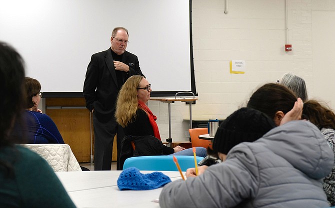 Dr. Wayne Harris, part of the two-member search team looking for a new superintendent of schools, talks to a focus group of parents who are active in Advisory Councils on Instruction at Syphax, on Friday night, January 24th.