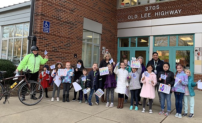 Evie Ifantides (in green jacket) is greeted at Daniels Run Elementary.