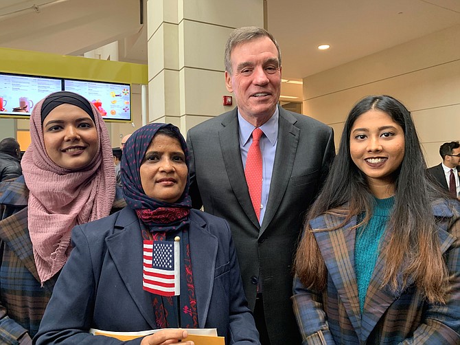 Sen. Mark Warner (D-Va.) stands with America’s newest citizens following the U.S. Citizenship and Immigration Services Oath of Allegiance  ceremony Jan. 31 at the U.S. Patent and Trademark Office.