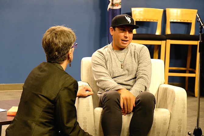 Tommy Orange, author of the book, “There There” speaks with Head Librarian, Diane Kresh, at the “Arlington Reads” talk.  Kresh gave Orange the opening he needed to share his background and his struggle to retain his tribal identity.