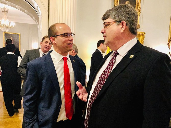 Alexandria Mayor Justin Wilson, left, chats with Norton Mayor Joseph Fawbush at the Executive Mansion during a launch event for the Local Government Exchange Program.