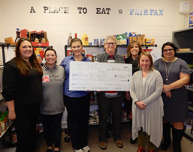 Pantry check-presentation: (From left) are Laura Rotella, Katy Malesky, Erin Lenart, Kären Rasmussen, Chris Garris, Ashley Curl and Nikki Clifford.