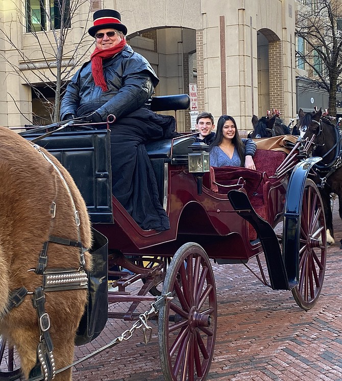 Chloe Richmond and Brendan Miers of Chantilly prepare for a romantic tour of Reston Town Center in a horse-drawn carriage on Valentine's Day.