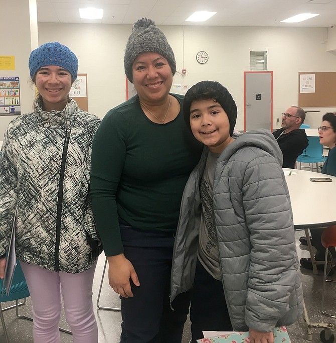 Maria Nightingale with Lauren and Connor, two of her three children. She brought her children to the meeting of parents who wanted to hear about the search for a new school superintendent in Arlington. Her daughter, Valentine, was unable to attend the meeting.