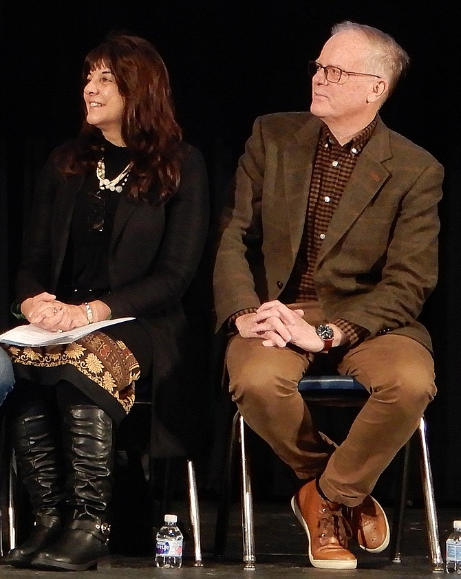 Lisa and Lou Gallo listen to Principal Scott Poole speak.