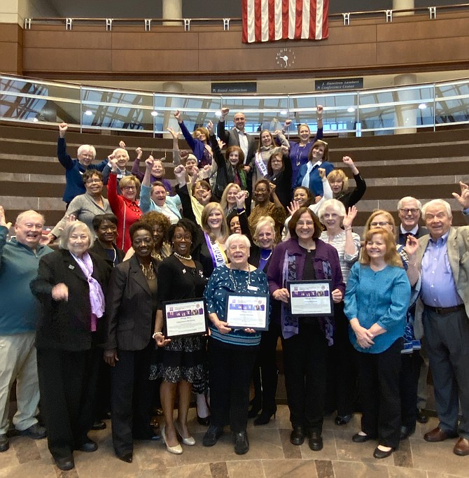 During the Women's History Month 2020 Celebration presented by the Fairfax County Commission for Women on March 10, coinciding in the same year as the Centennial of the 19th Amendment, members of the Commission and others celebrate after honoring three women, Jane Barker, Cypriana McCray and Laura McKie who did much for the 100th anniversary cause.