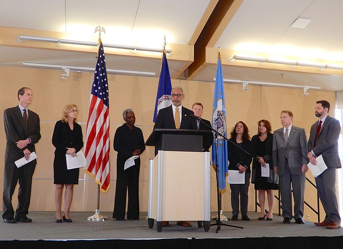 State Health Commissioner Oliver at the podium. (From left) are Dr. Ben Schwartz, Dr. Lilian Peake, Dr. Gloria Addo-Ayensu, Dr. Norm Oliver, Jeff McKay, Dr. Denise Toney, Dr. Alison Ansher, David Meyer and John Silcox.