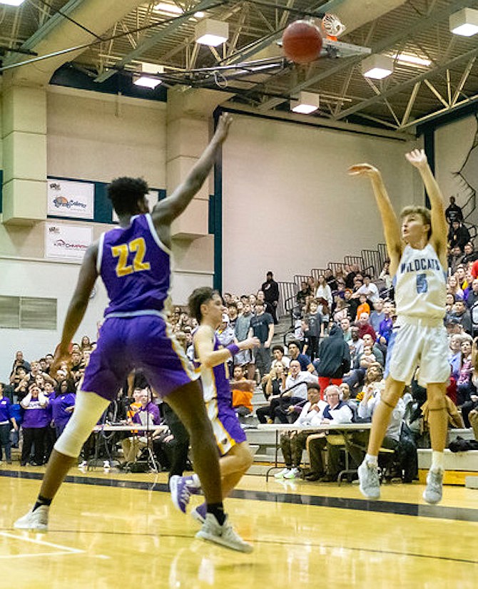 John Hunter’s winning three point shot goes in for Centreville.