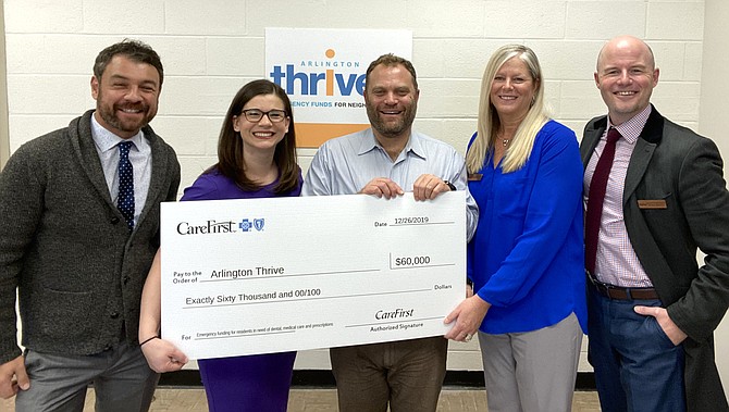 From left, Vadim Pogosov and Jeanine Finch, Community Affairs Liaisons for Northern Virginia-CareFirst BlueCross BlueShield; Andrew Schneider, Thrive Executive Director; Shandra Niswander, Thrive Director of Development; and Scott Friedrich, Arlington Thrive Board of Directors, Incoming Board President, celebrating the grant of $60,000.