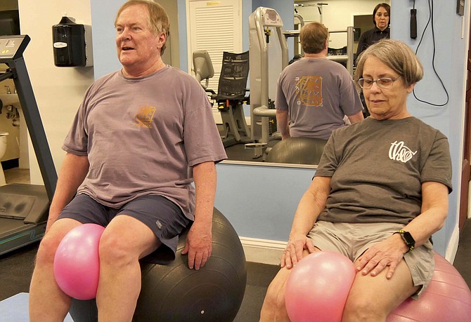 Cynthia and Jeremy balance on large balls. “It’s harder than you think.”