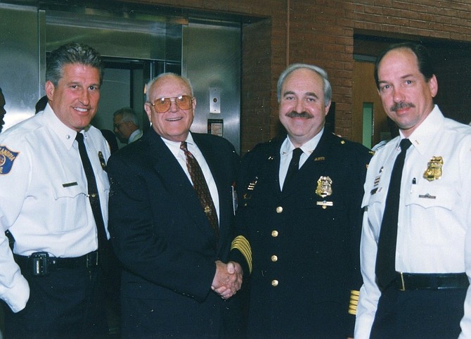 Former Alexandria Chief of Police Charles Samarra, second from right, died March 17 following a three-month battle with a brain tumor. He was 74.