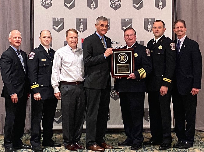 (From left) are Chief Ralph Ensign, CFAI peer team leader (Ret. Chief, Glenview, Ill.); Capt. Brian Orndoff, Fairfax City Fire Dept. EMS officer; Fairfax Mayor David Meyer; Chief Steve Dongworth, CFAI chair, (Calgary, Canada); City Fire Chief John O’Neal; Capt. Shawn Dunstan, Fairfax City Fire Dept. accreditation manager; and City Manager Rob Stalzer.