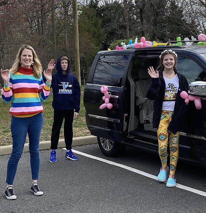 Ellen O’Hearn, Cunningham Park Elementary School art teacher and her children, Nick, 14, an eighth grader at Thoreau Middle School and Chloe, 12, a sixth grader at Stenwood Elementary School, make sure all the balloons are ok before joining the school’s Love Parade.