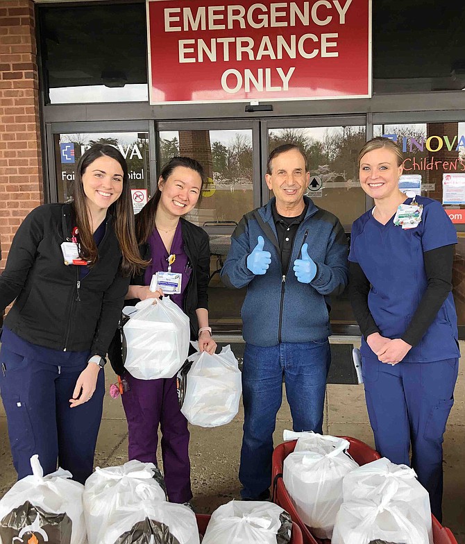 Sal Speziale (thumbs up) brings dinner from Ciao to Inova Fair Oaks emergency-room nurses.