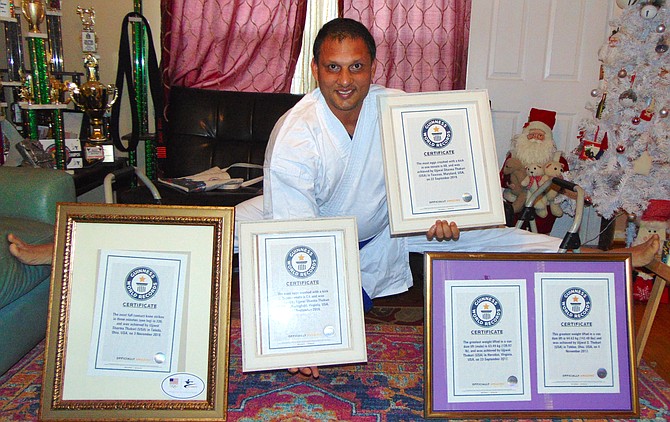 Guinness World Record holder Ujjwal Sharma Thakuri of Springfield with his five world record certificates.