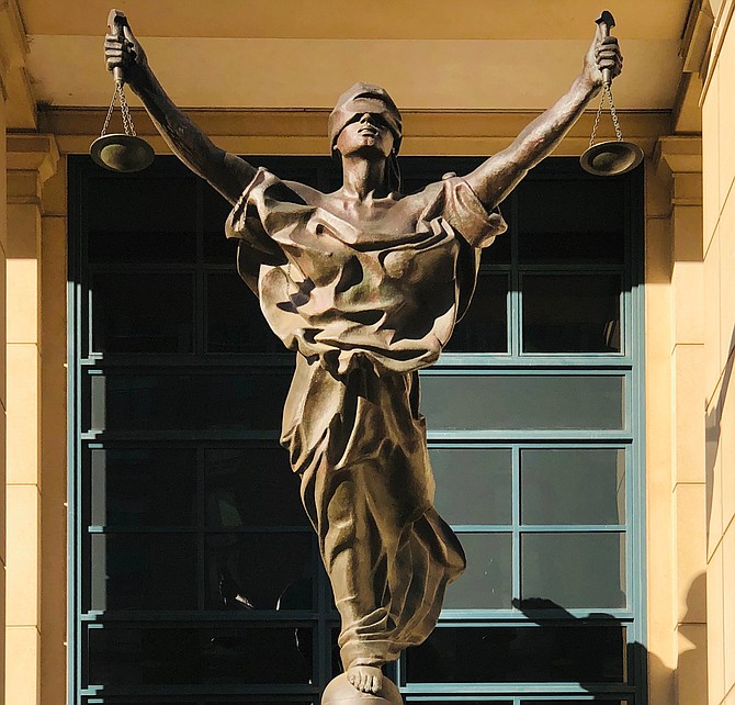 The title of the famous statue at the Albert Bryan U.S. Courthouse in Alexandria is “Justice Delayed, Justice Denied.”