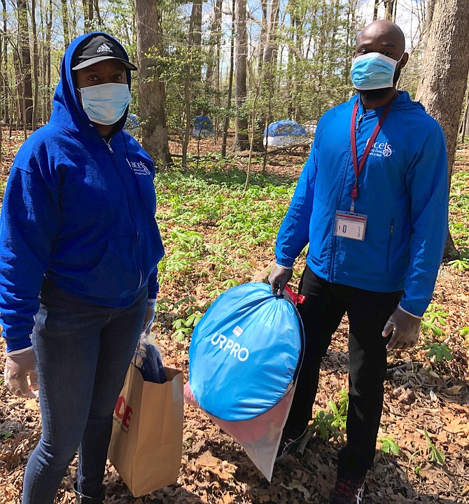 FACETS case manager and medical outreach worker going into the woods to provide medical screenings and advice to clients about protecting themselves.
