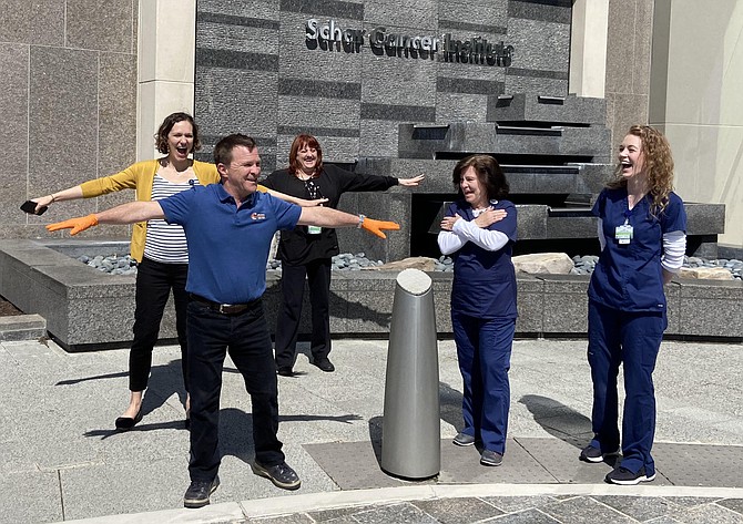 Chantilly’s Matt Curry does social distancing from nurses outside the Schar Cancer Institute after a meal delivery there.