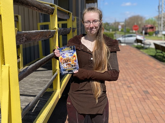 Leah Ning of Herndon holds a newly released copy of  "L. Ron Hubbard Presents Writers of the Future Volume 36," released April 7, 2020. In the anthology, which named only 12 winner writers globally, is Ning’s winning story, "Yellow and Pink."