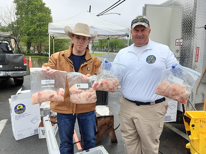 Darry Cross, in cowboy hat, and Ed Moore with their fresh catfish filets.