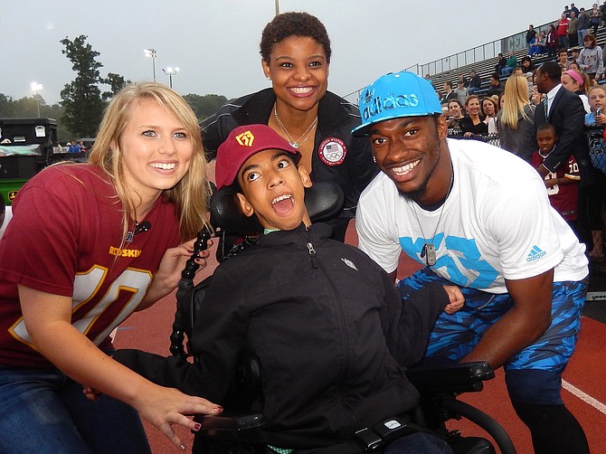 From left are Morgan Assel, Juwaan Espinal, U.S. Olympic fencer Nzingha Prescod and Robert Griffin III.