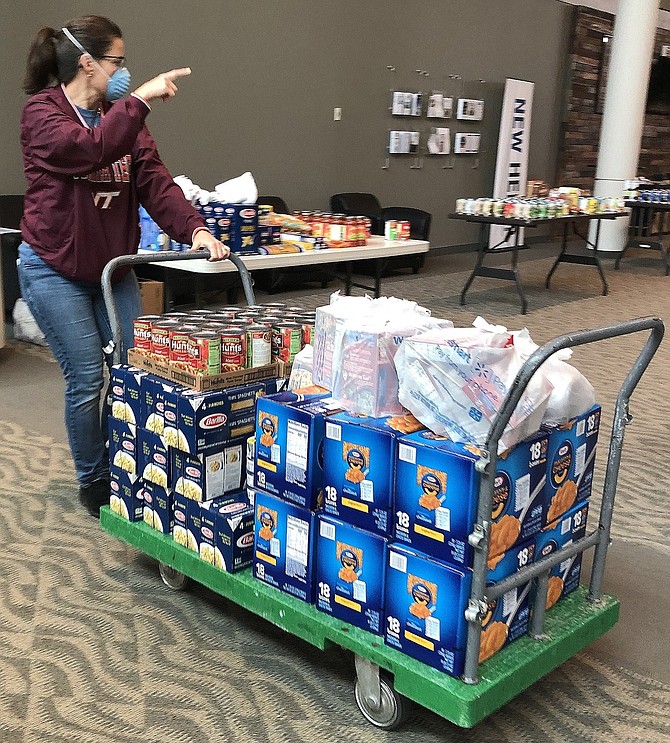 Nicole Martinez at Centreville Baptist Church with food for distribution.