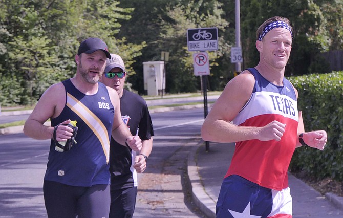 Babb (left) is joined by his friends, Jered, originally from Texas, and Peter, who lives locally, to keep him company on his marathon run.