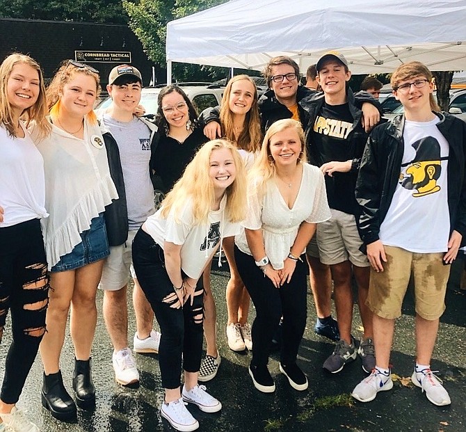 Bailey Shannon, of Vienna,  (bottom left) with a group of friends tailgating at an Appalachian State University football game this past fall.