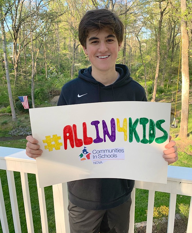 Will Navas holds a sign with the #allin4kids slogan in a post to spread awareness. He is also using the hashtag to track people running and their times through social media posts. The GoFundMe Will Navas set up – gf.me/u/xxy3sz – is where people can pay their registration fee for the 5k.