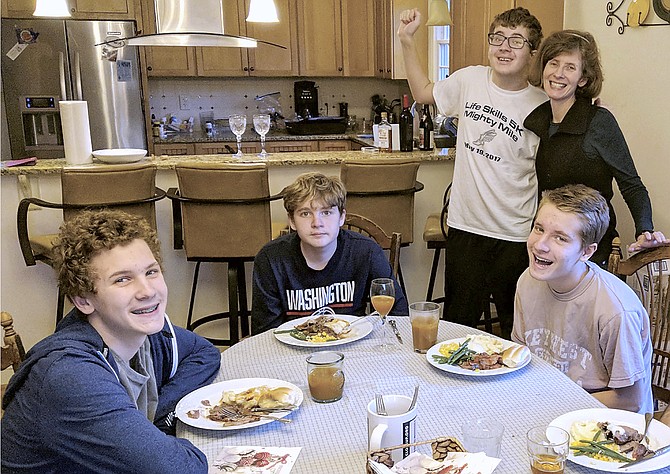 Linda McKenna Gulyn, Ph.D. – pictured with her two sets of twin sons – works full-time and says that managing her sons’ school work is the most difficult part of parenting during COVID19.