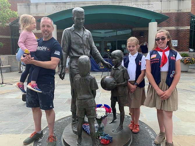 Paul Doerrer, holding daughter Helena, with daughters Lena and Marin at the Rocky Versace Plaza in Del Ray. The family paid a Memorial Day visit to the memorial to honor the city’s fallen veterans.