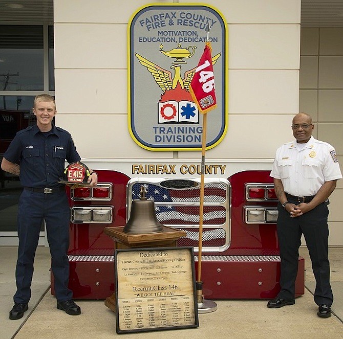 (From left) new firefighter Christopher Wolf and Fairfax County Fire Chief John Butler.