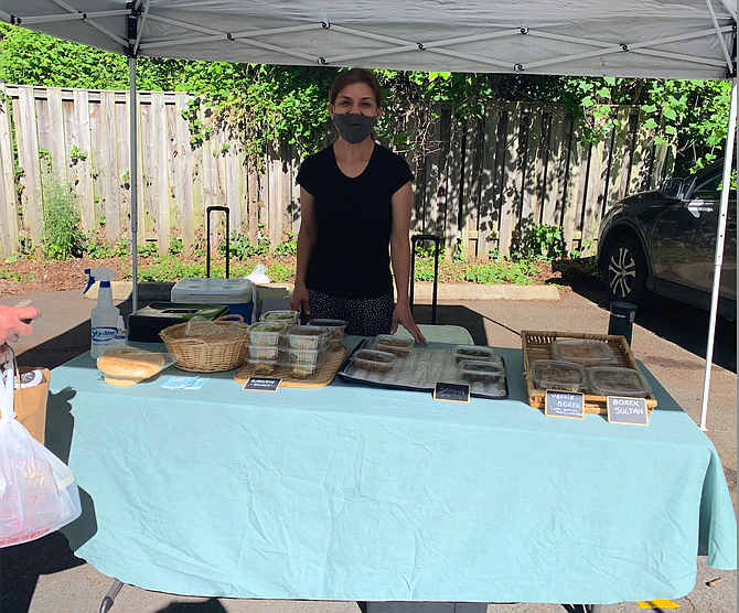 Feride Ozkan, owner and chef of Ozfeka Catering, working at her booth.