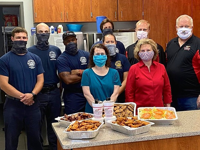 The Friendship Veterans Fire Engine Association delivers a meal from Foster’s Grille to AFD headquarters June 5. Pictured in back, left to right, are Tyler Fredericks, Russel Thorne, Myron Dent, Erin Mustian, Scott Corder, Michael Catts and Bruce Catts. In front are Catherine Weinraub and Marion Moon.