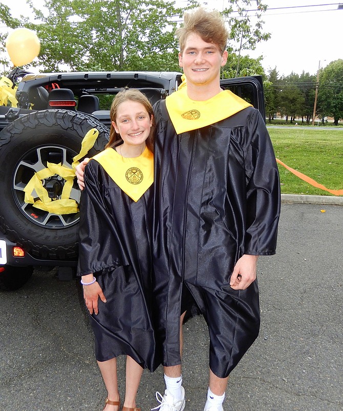 Paul VI High seniors Ava Burkat and Colby Davoren pose before their graduation parade.