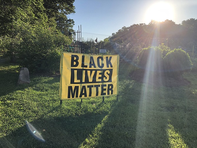 The Black Lives Matter banner shown here, along with its posts, was reported stolen from the church grounds of the Unitarian Universalist Church Reston on June 19 (Juneteenth).