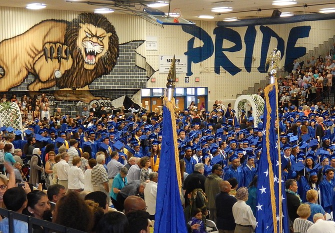 The lion, already painted on the wall of Fairfax High’s field house – shown during a past graduation ceremony there – is now the school’s new mascot.