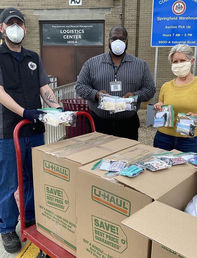 (Right) Gwyn Whittaker delivers 5,000 2-ply cotton masks sewed by contracted Makers for GreenFare Health and Wellness, a 501(c) (3) organization to County of Fairfax, Logistics Center at 6800-A Industrial Road in Springfield. (From left) Jason Reinsburrow, Ronald Garner, County of Fairfax Procurement & Material Mgmt. and Gwyn Whittaker, CEO of GreenFare Health and Wellness.